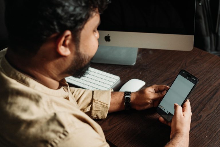 Man, smartphone, social media — How To Achieve Best WordPress SEO Results